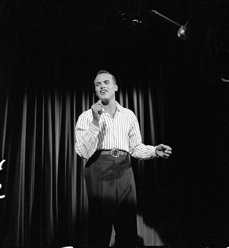 American singer, Calypso singer, and civil rights activist Harry Belafonte sings on Ed Sullivan's CBS variety show, 'Toast of the Town,' New York, October 11, 1953. (Photo by CBS Photo Archive/Getty Images)