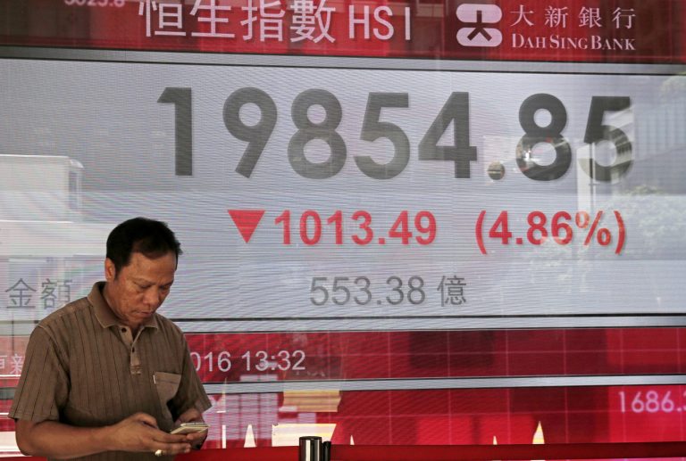 Asian stock markets fell sharply on Friday with Tokyo stocks, U.S. futures and oil prices plunging as the early results in Britain's referendum challenged the earlier anticipation that Britain would remain in the European Union. (AP Photo/Kin Cheung)