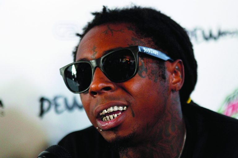 FILE - In this Sept. 26, 2012 file photo, recording artist Lil Wayne speaks during an interview with The Associated Press in New Orleans. The launch of a skate park by rapper Lil Wayne and a host of big-money sponsors, including Mountain Dew, hasn't gotten off to an easy start. The building the skate park is housed in didn't pass an electrical inspection and has to be re-wired, and only a handful of kids are able to skate at a time because of a shortage of staffing. (AP Photo/Gerald Herbert, File)