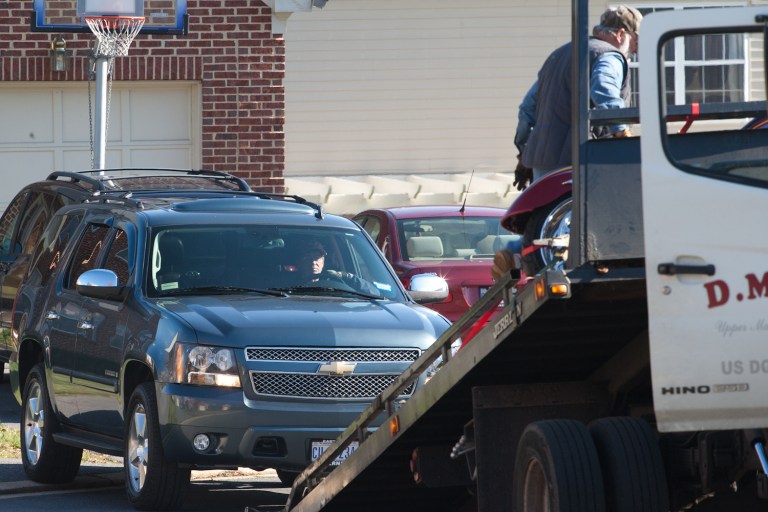An SUV is taken away outside the house of former D.C. Councilman Harry Thomas Jr. on Dec. 2, 2011. (Graeme Jennings/Examiner)