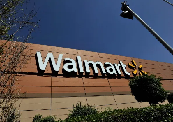 MEXICO CITY, MEXICO - APRIL 23:  Wal-Mart store signage is seen from the store lot on April 23, 2012 in Mexico City, Mexico. According to reports, Wal-Mart de Mexico orchestrated a campaign of bribery to win market dominance by paying bribes to obtain permits in parts of the country. Wal-Mart Inc, along with two U.S. congressmen is conducting internal investigations over the allegations.  (Photo by Daniel Aguilar/Getty Images)