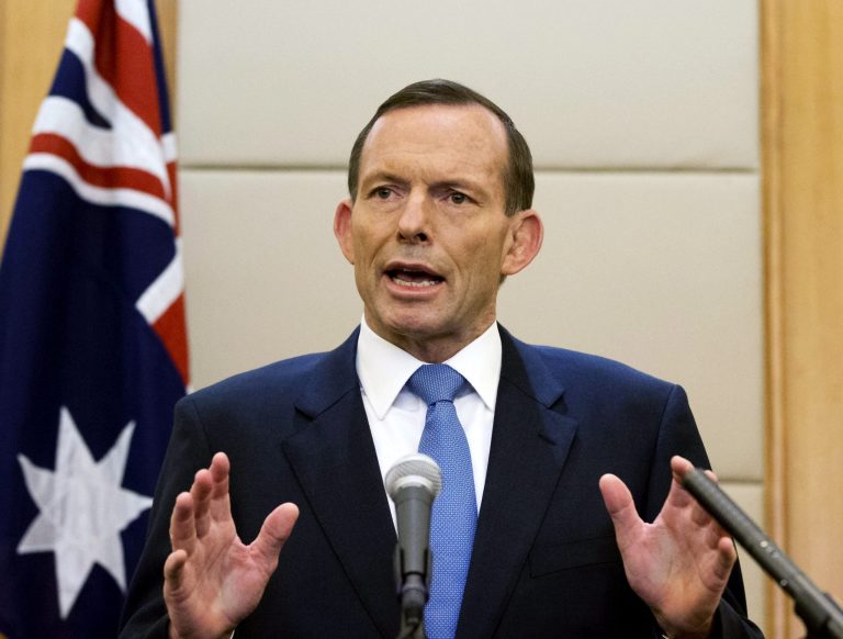 FILE - In this April 12, 2014, Australian Prime Minister Tony Abbott speaks during a press conference at a hotel in Beijing, China.  Abbott has promised to share the pain in his conservative government's first annual budget aimed at reducing national debt. His government's financial blueprint for the next fiscal year beginning on July 1 to be revealed to Parliament on Tuesday, May 13, 2014,  also promises to be politically damaging after his coalition was elected in September on a pledge not to increase taxes. (AP Photo/Andy Wong, File)