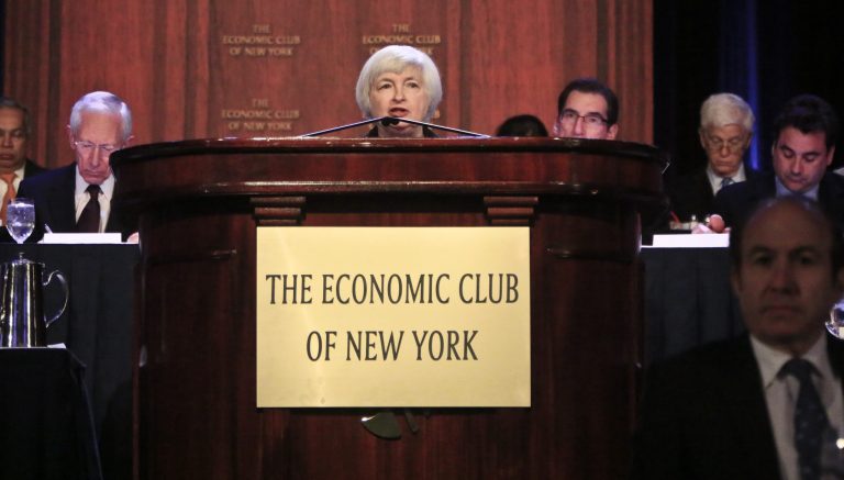 Federal Reserve Chairwoman Janet Yellen, center, speaks during a luncheon at the Economic Club of New York on Wednesday, April 16, 2014. Yellen said Wednesday that the U.S. job market still needs help from the Fed and that the central bank must remain intent on adjusting its policy to respond to unforeseen challenges. (AP Photo/Bebeto Matthews)