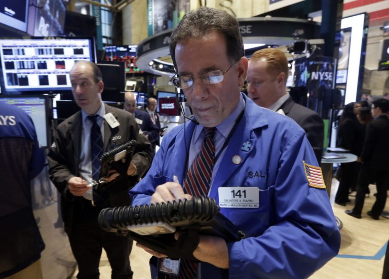 Trader Sal Suarino works on the floor of the New York Stock Exchange, Friday, Feb. 21, 2014. U.S. stocks are inching higher in early trading, putting the Standard & Poor's 500 index on track for its third straight week of gains. (AP Photo/Richard Drew)