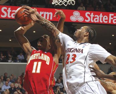 Andrew Shurtleff/APMike Scott and Virginia held Mychal Parker and Maryland to 26.9 percent shooting from the field in a blowout Saturday afternoon.