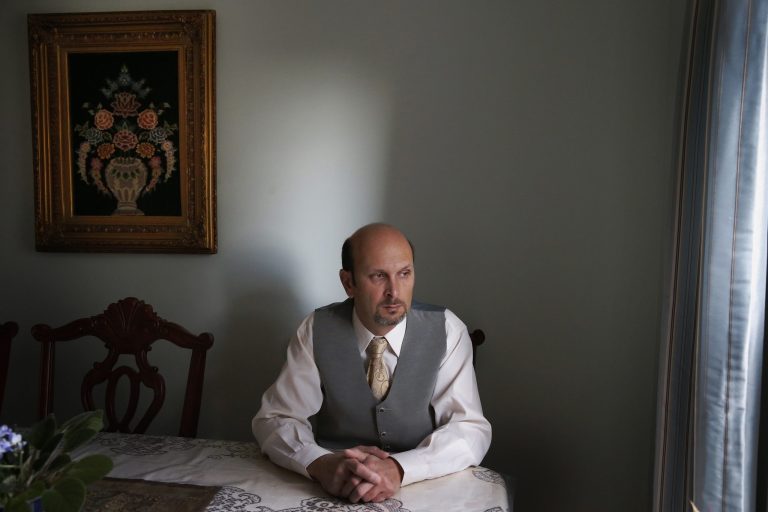 Real estate agent Morteza Assadi, 49, in his home in Vienna, Va. The Obama administration has eased the rules for would-be asylum seekers, refugees and others who hope to come to the United States or stay here and who gave ``limitedâ support to terrorists or terrorist groups. For Assadi, the law has left him in a sort of immigration purgatory while his green card application has been on hold for more than a decade. (AP/Charles Dharapak)
