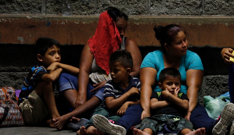 Migrants planning to join a new caravan of several hundred people setting out in hopes of reaching the distant United States, wait at the bus station in San Pedro Sula, Honduras, Tuesday, April 9, 2019. Parents who gathered at the bus station to leave with Wednesday morning's caravan say they can't support their families with what they can earn in Honduras and are seeking better opportunities. 