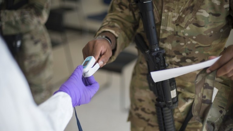 Soldiers attached to the Texas Army National Guard's 36th Infantry Division and 272th Engineer Company receive an COVID-19 IgG, IgM antigen test at Camp Swift in Bastrop, Texas June 9, 2020. 