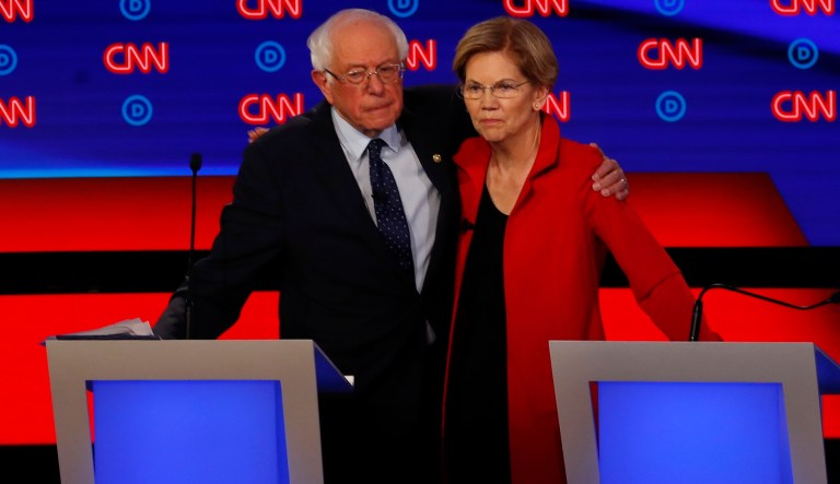 Sen. Bernie Sanders, I-Vt., and Sen. Elizabeth Warren, D-Mass., embrace after the first of two Democratic presidential primary debates hosted by CNN Tuesday, July 30, 2019, in the Fox Theatre in Detroit. 