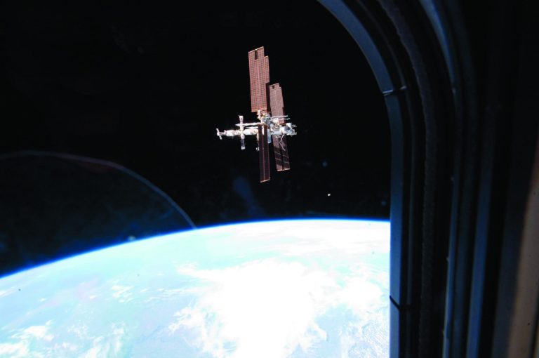 FILE - This Tuesday, July 19, 2011 image provided by NASA shows the International Space Station photographed by a member of Atlantis' STS-135 crew during a fly around as the shuttle departed the station on the last space shuttle mission. A panel of outside experts said Wednesday, Dec. 5, 2012 that NASA is adrift without a coherent vision for where it should be going. The report by the National Academy of Sciences doesn't blame the space agency. It faults the president, Congress and the nation. (AP Photo/NASA)