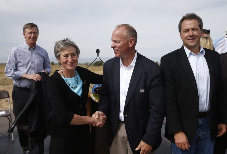 Interior Secretary Sally Jewell, second from left, shakes hands with Wyoming Gov. Matt Mead at a gathering where Secretary Jewell made the formal announcement that the greater sage grouse, a ground-dwelling bird whose vast range spans 11 Western states, does not need federal protections. (AP Photo/Brennan Linsley)