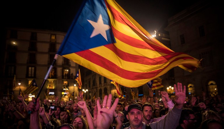 Pro-independence supporters cheer and wave 