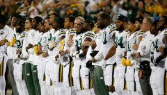 Green Bay Packers and Chicago Bears link arms during national anthem before Thursday night game