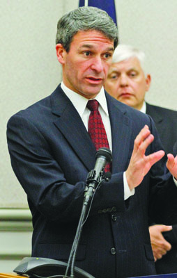 Virginia Attorney General Ken Cuccinelli, left,  gestures during a press conference as Bedford County Sheriff, Maj. Ricky Gardner, right, listens  in Richmond, Va., Thursday, April 5, 2012.   Cuccinelli announced 