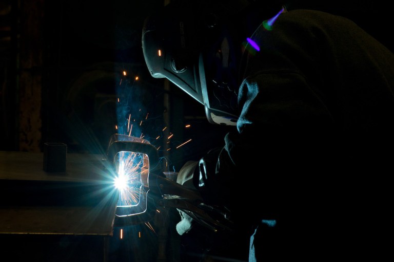 An employee welds a part at a facility in Illinois, U.S. 