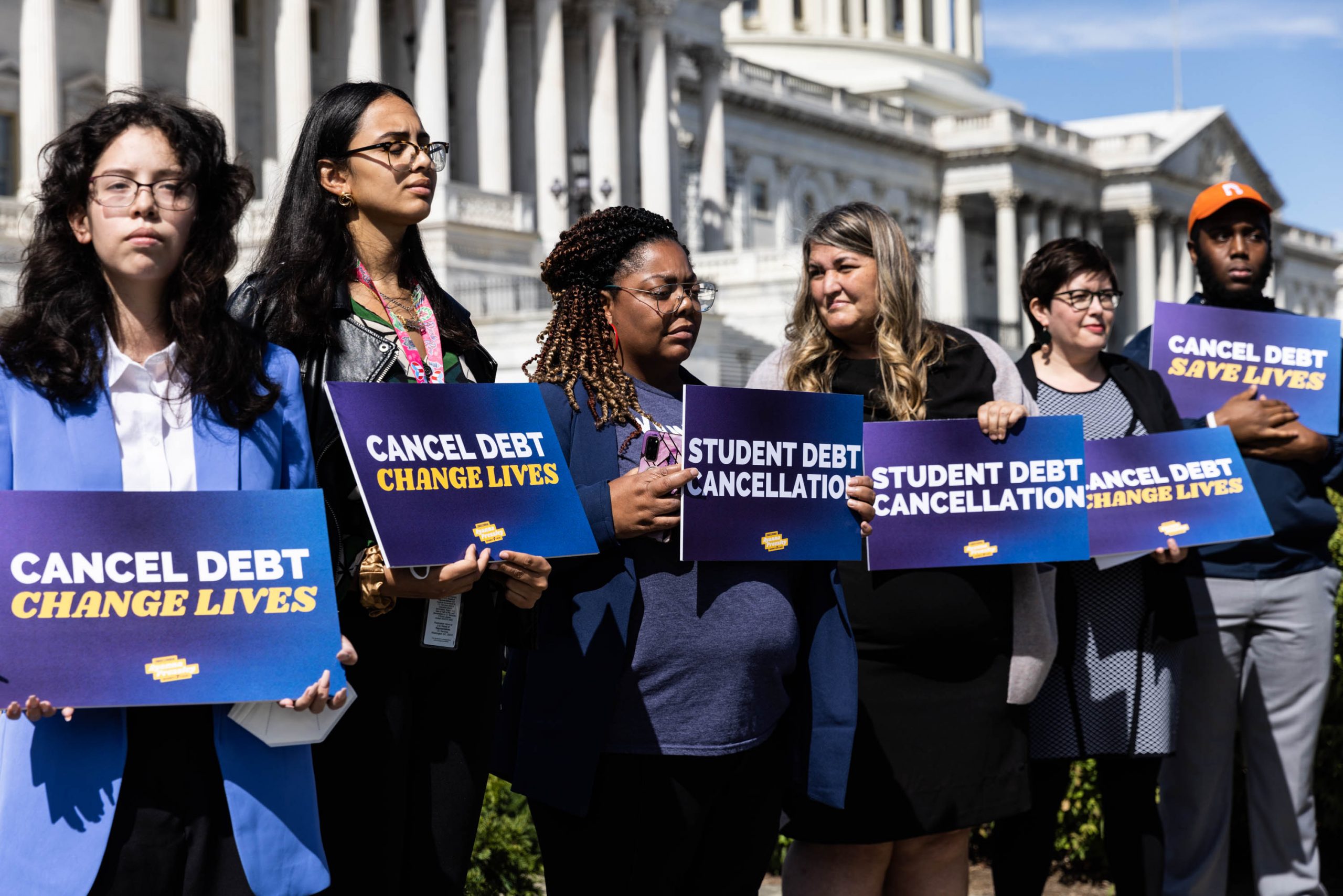 Students gather at a news conference on student debt cancellation on Capitol Hill, Sept. 29, 2022. Lawmakers called for the swift and equitable implementation of U.S. President Joe Biden's student debt relief plan.