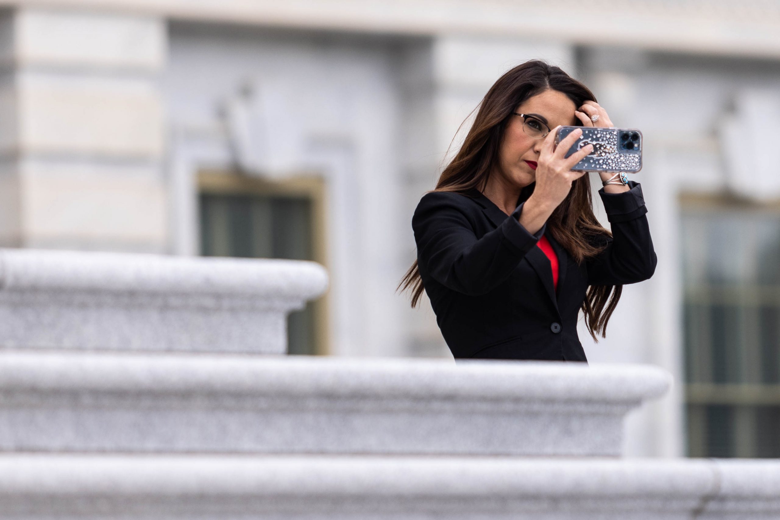 Rep. Lauren Boebert takes a selfie on the east steps of the U.S. Capitol, Friday, Sept. 30, 2022.