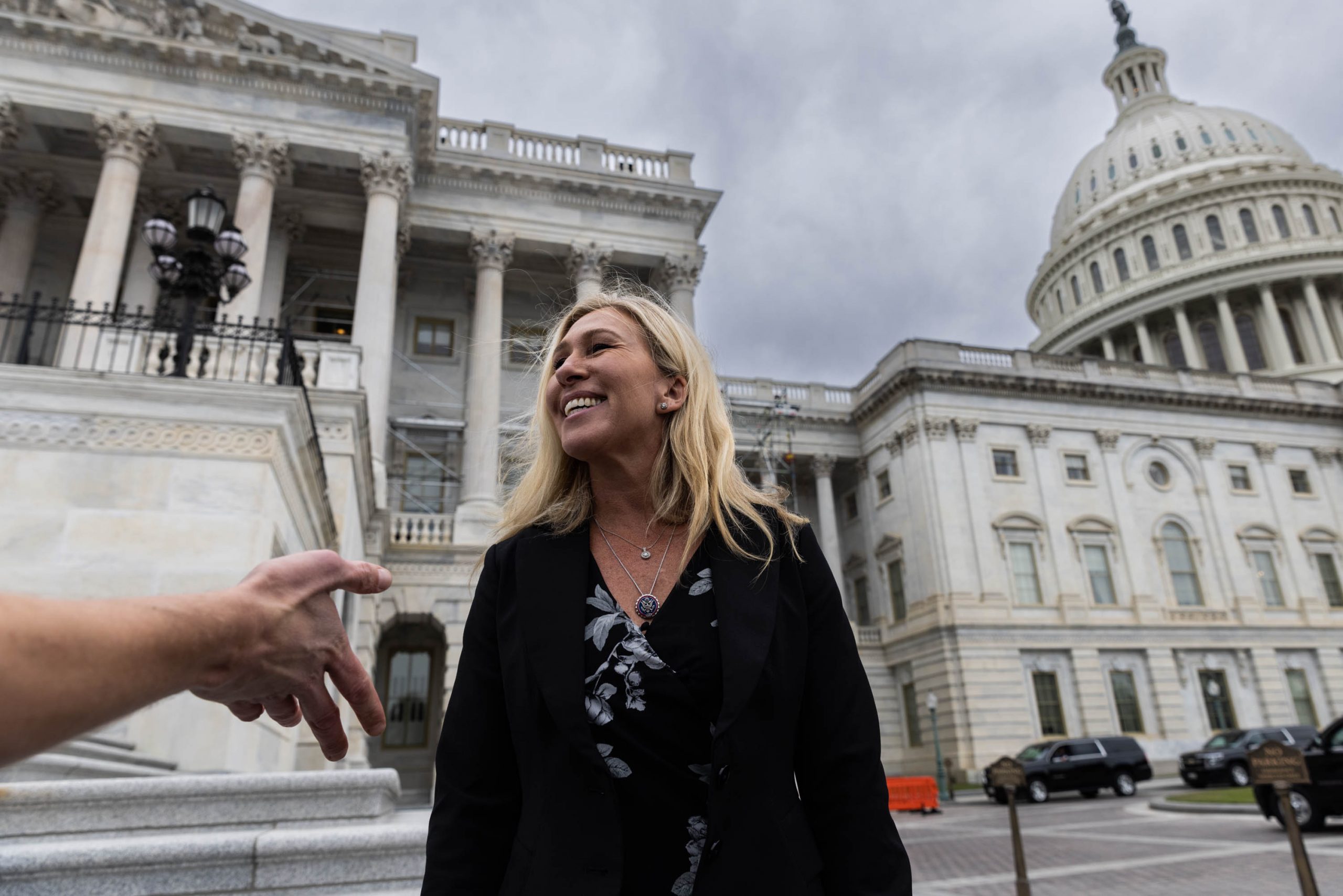 Rep. Marjorie Taylor Greene, R-GA, speaks to journalists outside of the U.S. Capitol, Friday, Sept. 30, 2022. Perry Greene, the husband of Greene, filed for divorce in Floyd County Superior Court this week, stating that the marriage is "irretrievably broken."
