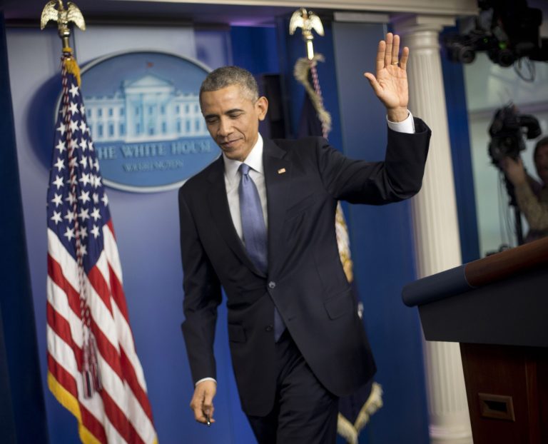 President Obama waves to reporters at the conclusion of a news conference in the Brady Press Briefing Room of the White House in Washington, Friday, Dec. 19, 2014. The president claimed an array of successes in 2014, citing lower unemployment, a rising number of Americans covered by health insurance, and an historic diplomatic opening with Cuba. He also touts his own executive action and a Chinese agreement to combat global warming. (AP Photo/Pablo Martinez Monsivais )