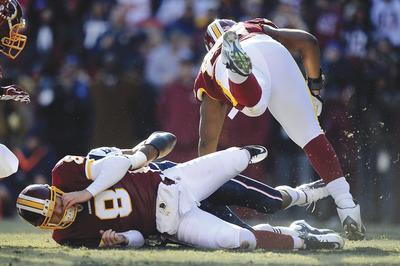 Patrick McDermott/Getty Images
Rex Grossman was sacked and fumbled in the end zone in the first quarter, leading to the Patriots'first touchdown on Sunday.
