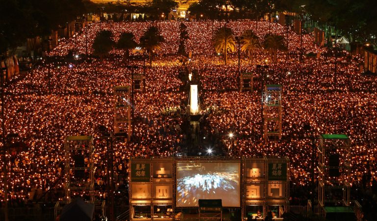Tens of thousands of people attend a candlelight vigil at Victoria Park in Hong Kong Wednesday, June 4, 2014, to mark the 25th anniversary of the June 4th Chinese military crackdown on the pro-democracy movement in Beijing. (AP Photo/Cyrus Wong)