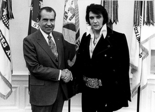 FILE PHOTO: President Richard Nixon meets with Elvis Presley December 21, 1970 at the White House. (Photo by National Archives)
