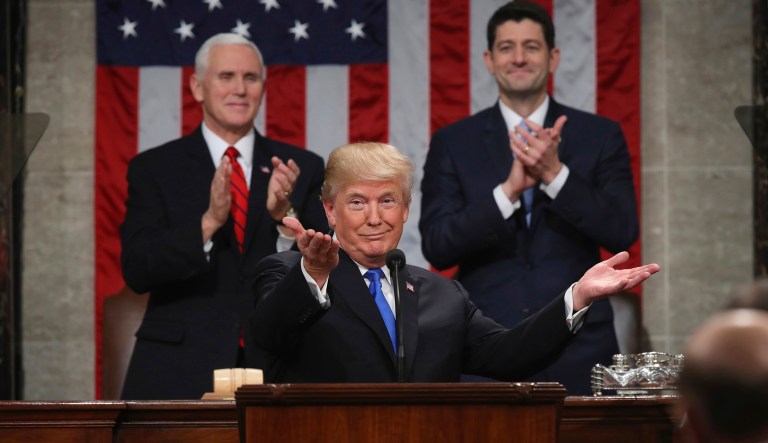 President Trump gestures as delivers his first State of the Union address in the House chamber of the U.S. Capitol to a joint session of Congress. (Win McNamee/Pool via AP)