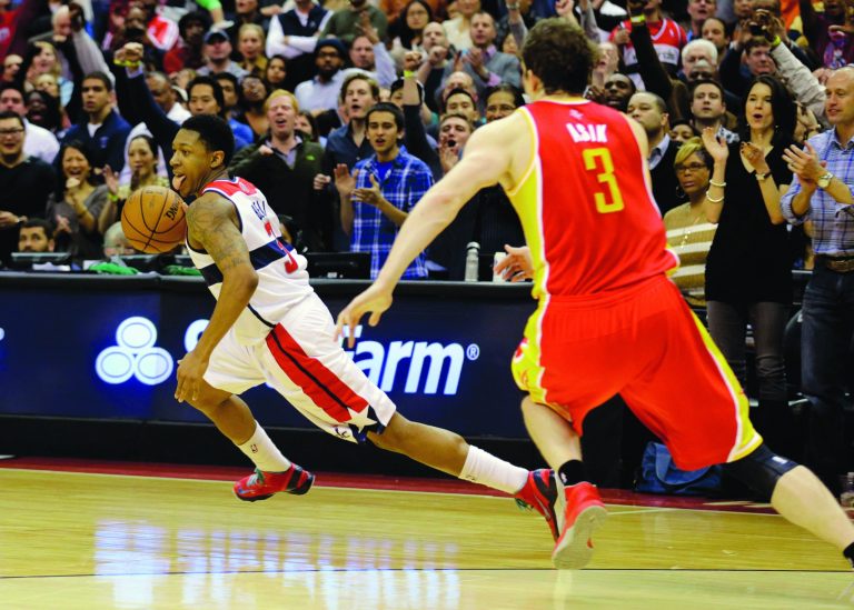Alex Brandon/AP
Bradley Beal won a rebound away from Omer Asik in the final seconds of the Wizards' comeback victory over the Rockets on Saturday.