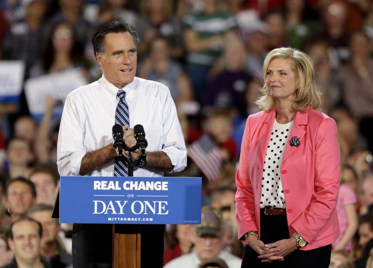 Republican presidential candidate, former Massachusetts Gov. Mitt Romney, left, steps to the podium after being introduced by his wife Ann, at a campaign event at Colorado Springs Municipal Airport, Saturday, Nov. 3, 2012, in Colorado Springs, Colo. (AP Photo/David Goldman)
