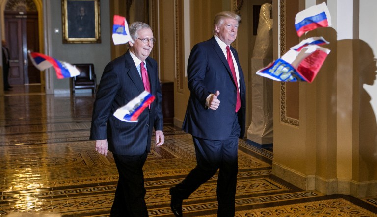 During the 40th week of his administration, President Trump had Russian flags tossed at him while walking to a GOP lunch at the Capitol. (Graeme Jennings/Washington Examiner)