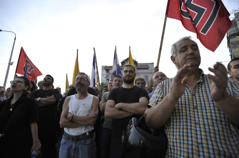   FILE - In this June 10, 2012, file photo, supporters of the extreme right-wing Golden Dawn party, attend a pre-election rally at the northern port city of Thessaloniki Greece. Bankers, governments and investors are starting to prepare for Greece to drop the euro currency, a move that could spread turmoil throughout the global financial system. A Greek election on Sunday, June 12, 2012, will go a long way toward determining whether it happens. (AP Photo/Nicolas Giakoumidis, File)  