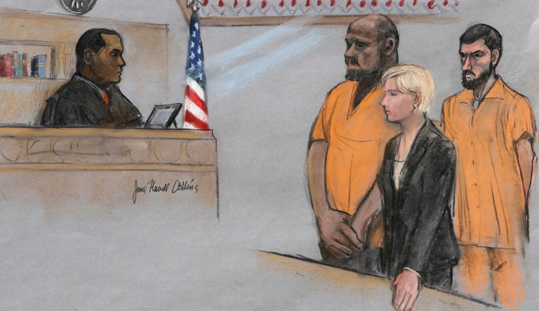 In this courtroom sketch, David Wright, second from left, is depicted standing before Magistrate Judge Donald Cabell, left, with attorney Jessica Hedges, second from right, and Nicholas Rovinski, right, during a hearing in federal court in Boston. (Jane Flavell Collins via AP, File)