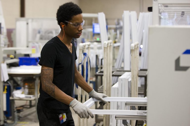 In this Thursday, Aug. 7, 2014 photo, a manufacturing worker assembles construction supplies at Northeast Building Products in Philadelphia. The Federal Reserve reports on industrial production for August, on Monday, Sept. 15, 2014. (AP Photo/Matt Rourke)