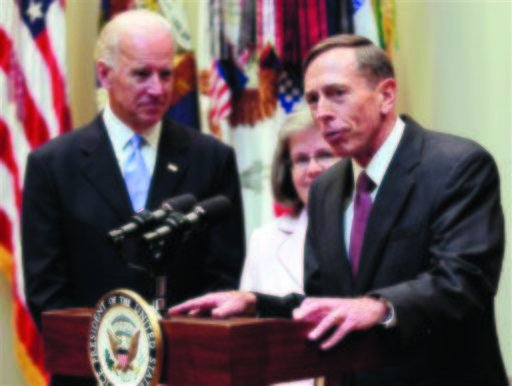 In this Sept. 6, 2011, file photo, new CIA director David Petraeus, right, accompanied by his wife Holly Knowlton Petraeus and Vice President Joe Biden, speaks following his swearing-in ceremony, in the Roosevelt Room of the White House in Washington. Petraeus has resigned as director of the CIA after admitting he had an extramarital affair. (AP Photo/Pablo Martinez Monsivais, File)