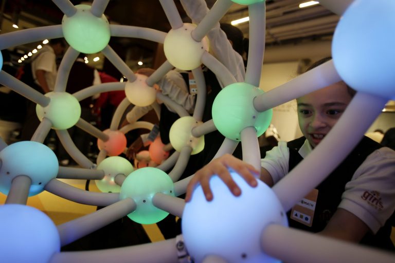   Girls Preparatory student Faith Guzman, 7, tries out an interactive display at the new National Museum of Mathematics in New York, Monday, Dec. 17, 2012. The museum is aimed at kids aged 8 to 13, and curators have given the place a playground feel. The 40 exhibits include a 