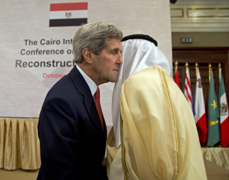 U. S. Secretary of State John Kerry greets Kuwaiti Foreign Minister Sabah Al-Khalid al-Sabah in Cairo, Egypt, Sunday, Oct. 12, 2014, during the Gaza Donor Conference. (AP Photo/Carolyn Kaster, Pool)