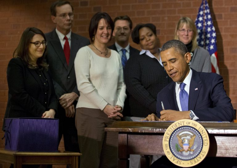 President Obama signs the $1.1 trillion spending bill that funds the federal government through the end of September, in Washington on Friday. (AP Photo/Jacquelyn Martin)