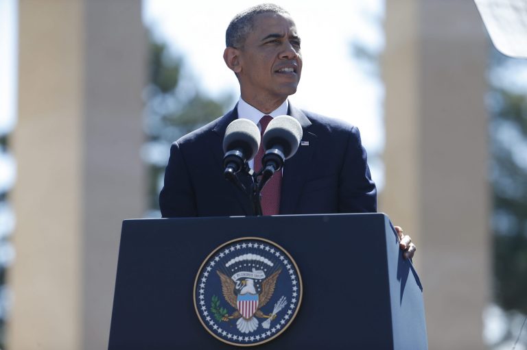 U.S. President Barack Obama  speaks at Normandy American Cemetery at Omaha Beach as he participates in the 70th anniversary of D-Day in Colleville sur Mer in Normandy, France, Friday, June 6, 2014. (AP Photo/Charles Dharapak)