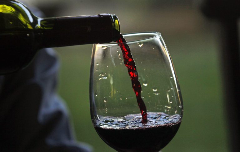 In this Jan. 25, 2014 photo, a man pours a glass of Erasmo wine at the Reserva de Caliboro vineyard in Maule Valley, Chile. A bold new wave of independent vintners are challenging Chile's reputation for producing oceans of agreeable but predictable wines. (AP Photo/Luis Hidalgo)