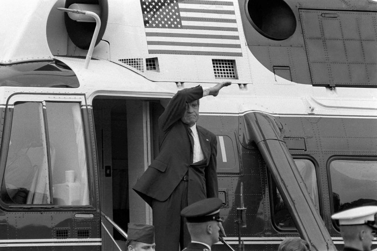 On the day of his resignation, Aug. 9, 1974, Richard M. Nixon waves goodbye from the steps of his helicopter as he leaves the White House following a farewell address to his staff. The Watergate scandal forced Nixon to become the first U.S. president to resign from office. (AP Photo/Chick Harrity)