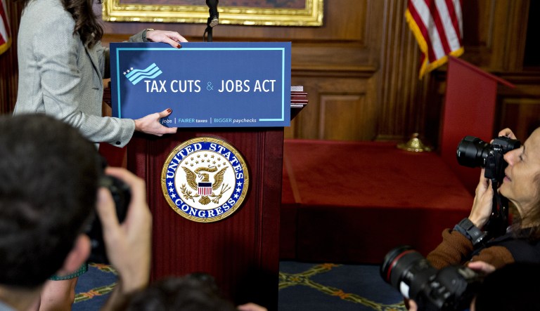 Democrats have sought to use the new tax law to their advantage, portraying it as a giveaway to the wealthy. New ads, however, will highlight claims that the law cut taxes for typical families and boost salaries. (Andrew Harrer/Bloomberg)