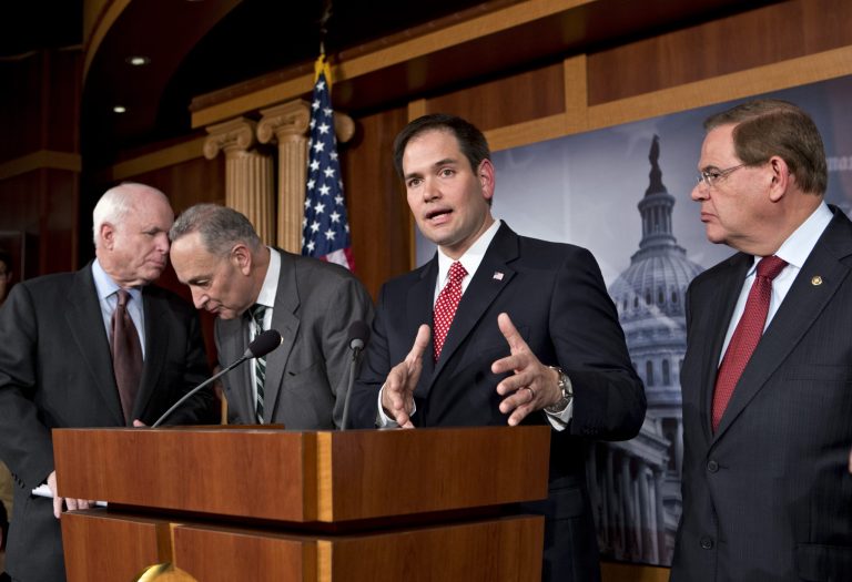 FILE - In this Jan. 28, 2013, file photo Sen. Marco Rubio, R-Fla., center,speaks at a Capitol Hill news conference with a bipartisan group of leading senators to announce their agreement on the principles of sweeping legislation to rewrite the nation's immigration laws. Eight senators meet in private several times a week, alternating between, from left, Sen. John McCain's, R-Ariz., and Sen. Charles Schumer's, D-N.Y., offices, and in a capital riven by partisanship and gridlock, they are determined to be the exception and actually get something done. This is immigration reform's 