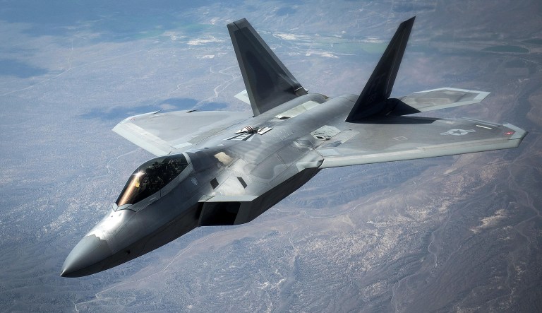 An F-22 Raptor flies by after receiving fuel from a KC-135 Stratotanker during exercise Red Flag 16-3 over Nellis Air Force Base, Nev., July 27, 2016.