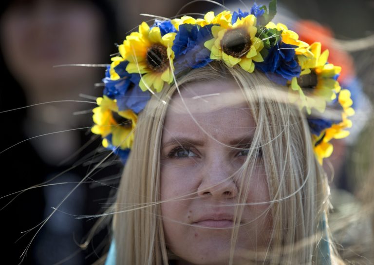 A pro-Ukrainian demonstrator attends a rally, in Simferopol, Ukraine, Saturday, March 15, 2014. Tensions are high in the Black Sea peninsula of Crimea, where a referendum is to be held Sunday on whether to split off from Ukraine and seek annexation by Russia. (AP Photo/Vadim Ghirda)
