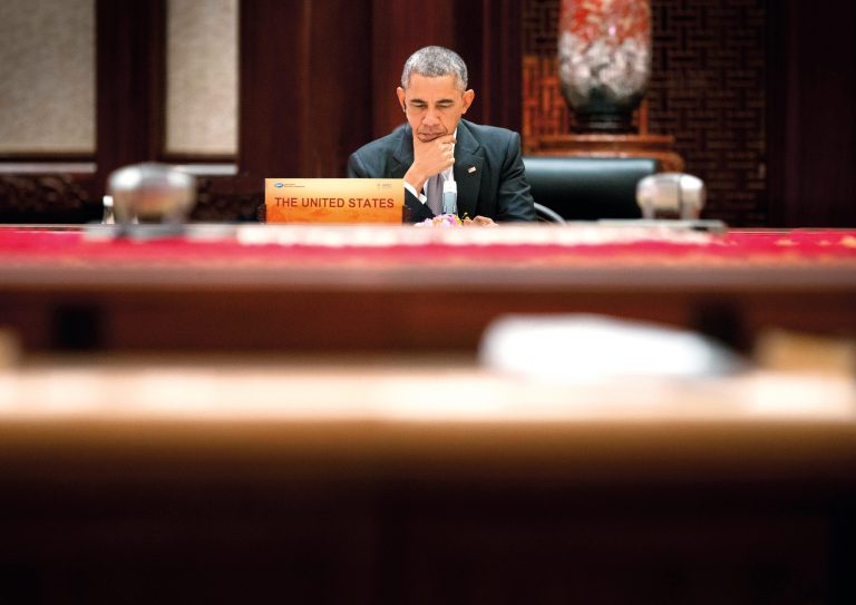 U.S. President Obama ponders at the the Asia-Pacific Economic Cooperation (APEC) Summit plenary session at the International Convention Center, Yanqi Lake, Tuesday, Nov. 11, 2014 in Beijing. (AP Photo/Pablo Martinez Monsivais, Pool)