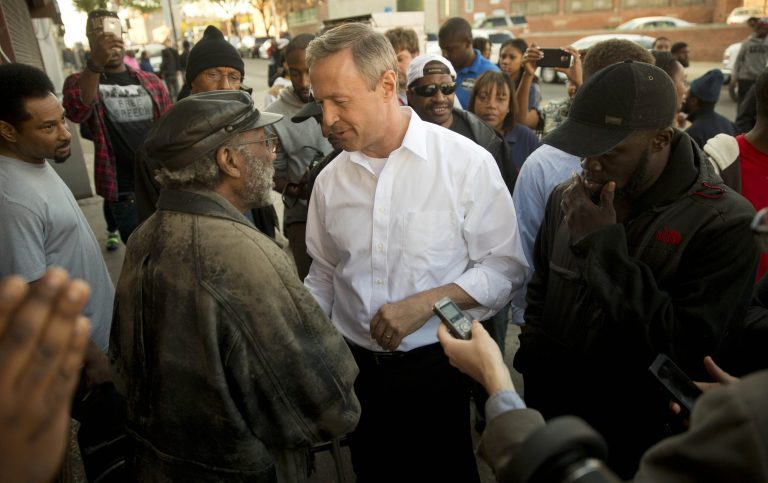 Former Maryland Gov. Martin O'Malley, center, meets with residents Tuesday, April 28, 2015, in Baltimore. (AP Photo/Matt Rourke)