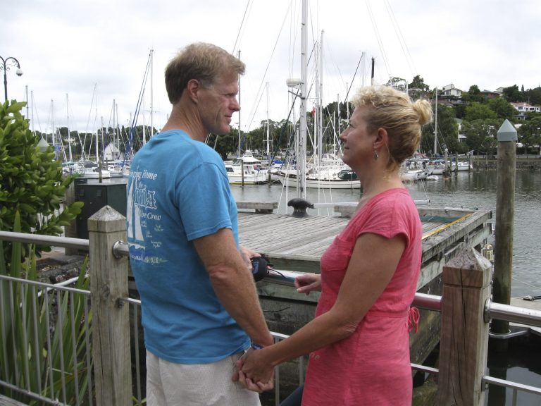 In this undated photo provided by Robin Wright, Ricky Wright and wife Robin Wright stand at a dock in the New Zealand port of Whangarei, where the Nina was moored in 2013. The boat was moved to the port of Opua before it left. (AP Photo/Robin Wright)