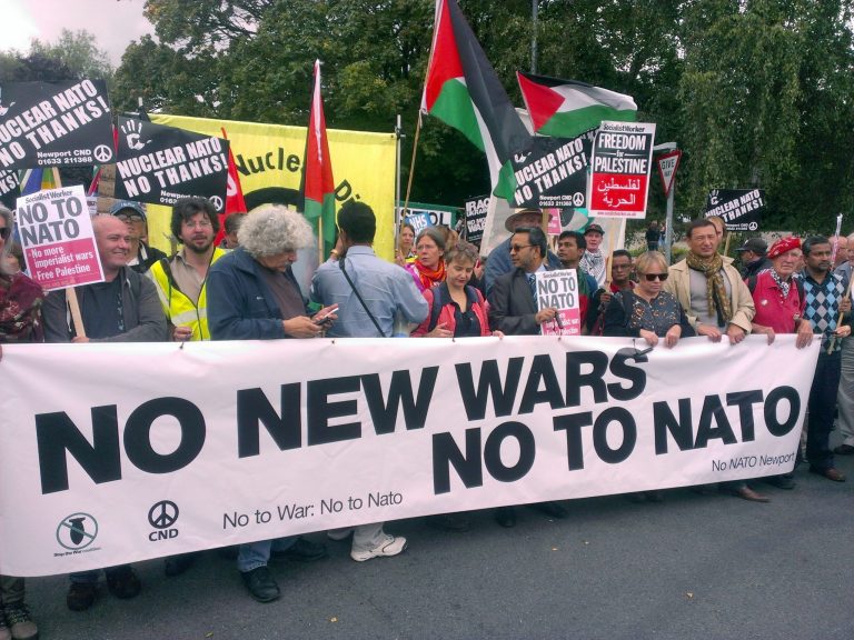 Supporters take part in the 'No to NATO' protest march in Newport, south Wales, Saturday, Aug. 30, 2014. Around 1,000 protesters have marched through the streets of Newport ahead of next week's NATO summit. More than 150 heads of state and ministers will attend the two-day event at Newport's Celtic Manor Resort. The event will be 
