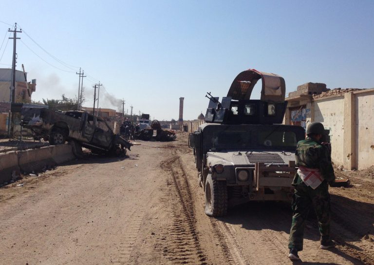 In this picture taken on Thursday, Feb. 6, 2014, Iraqi security forces patrol at Malaab district, which Iraqi troops recaptured recently, in Ramadi, 70 miles (115 kilometers) west of Baghdad, Iraq. Al-Qaida-led militants are battling for control of mainly Sunni areas to the west of the Iraqi capital in a key test of the Shiite-led government's ability to maintain security in the country more than two years after the withdrawal of U.S. troops. (AP Photo)
