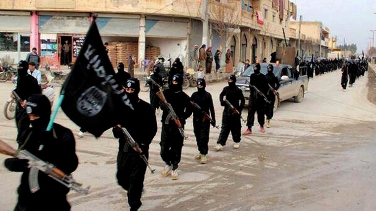 FILE - This undated file image posted on a militant website on Tuesday, Jan. 14, 2014 shows fighters from the al-Qaida-linked Islamic State of Iraq and the Levant (ISIL) marching in Raqqa, Syria. The Islamic State was originally al-Qaida's branch in Iraq, but it used Syria's civil war to vault into something more powerful. It defied orders from al-Qaida's central command and expanded its operations into Syria, ostensibly to fight to topple Assad. But it has turned mainly to conquering territory for itself, often battling other rebels who stand in the way. (AP Photo/Militant Website, File)